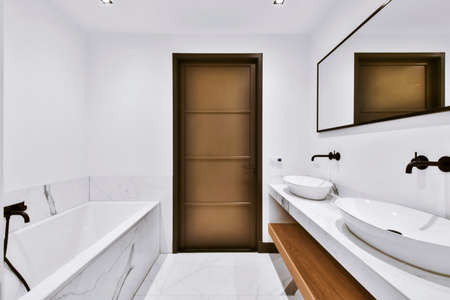 Stylish bathroom with marble floor and bathtub