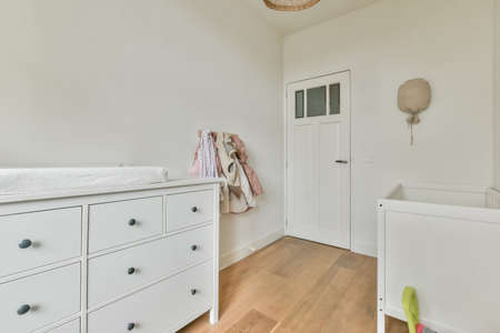 Interior of a cozy childrens room in white color and themed design