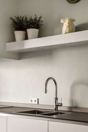 Modern sink located in the kitchen and built into the countertop