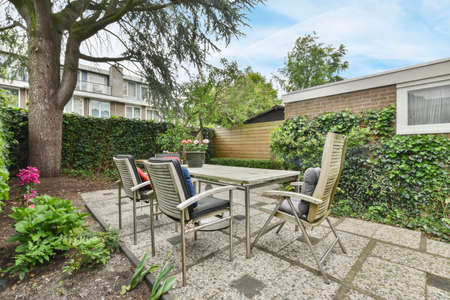 The backyard of the house is strewn with greenery and flowers. Vacation spot for the whole family