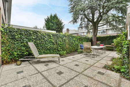 The backyard of the house is strewn with greenery and flowers. Vacation spot for the whole family