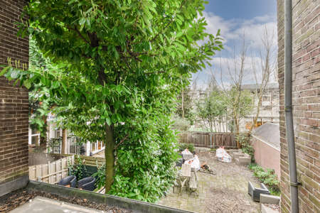 View from the balcony to the backyard with a cozy interior and beautiful natureの写真素材