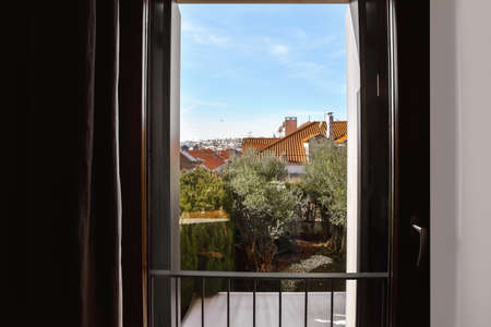Lovely view from the window with black curtains to the courtyard