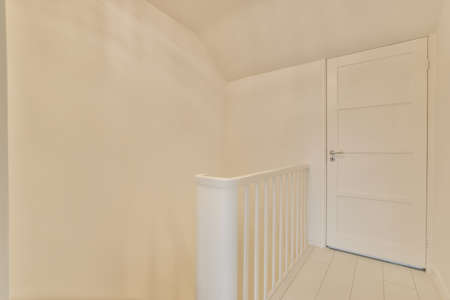 Interior of the corridor of the second floor of the apartment in white with doorの写真素材