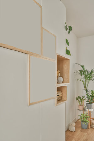 Home decoration using flowers, paintings and souvenirs located on shelves and table