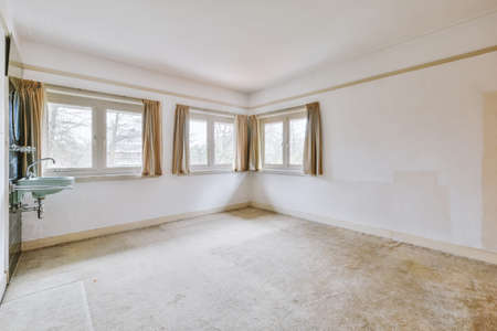 Room with three windows and wash side with mirror