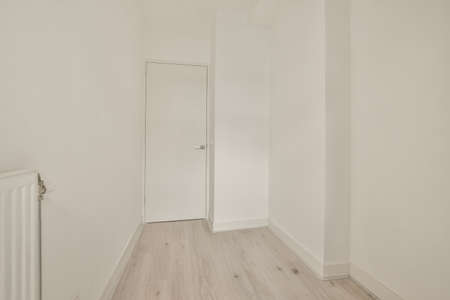 Spacious room in minimalist style and white design in a modern houseの写真素材