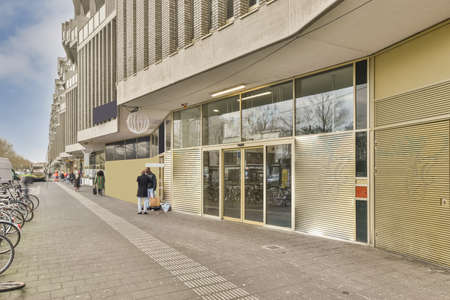 Entrance to a residential building built of light and dark brick
