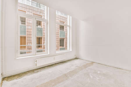 Spacious empty apartment in an open design with large windows in a minimalist style in a modern...