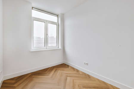 Plastic window on white wall in empty light room at home