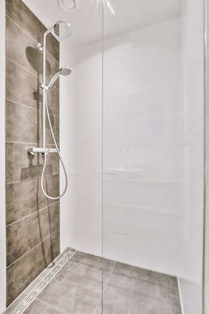 Modern shower stall in a bright bathroom