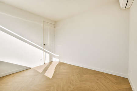 Plastic window and white wall in empty light room at home