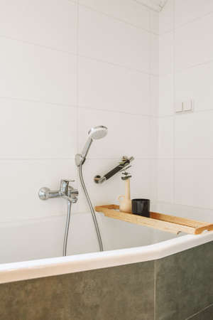 White ceramic bath tub with silver grey appliancesの写真素材