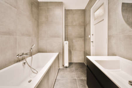 Interior of contemporary bathroom with shower and sink in minimal style in flatの写真素材