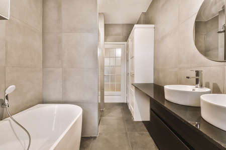 Interior of contemporary bathroom with shower and sink in minimal style in flatの写真素材