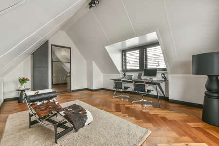 Spacious bright attic room for work and relaxation with a beautiful view from the window
