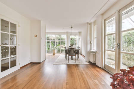Counters with stove and oven located in modern kitchen near dining room at home