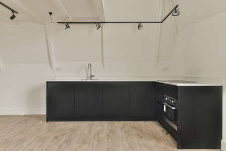 A cozy and spacious mansard styled empty room in a luxury houseの写真素材