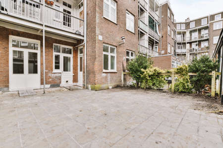 Neat paved near wooden fence