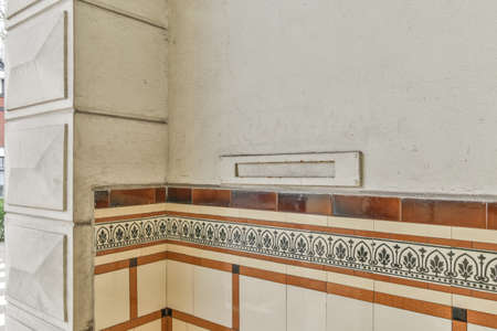 From below classic plaster floral ornament of medallion decorating ceiling above elegant chandelier at homeの写真素材