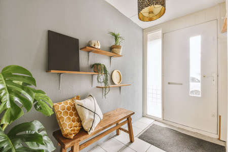 Corridor of contemporary apartment with doorway leading to terraceの写真素材