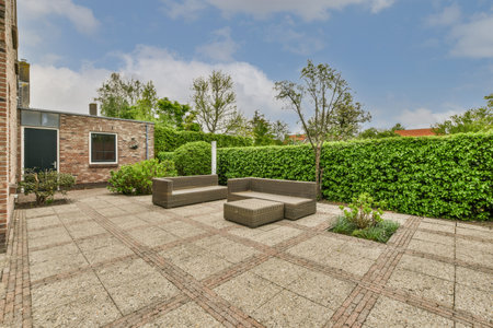 Neat powerful patio with sitting area and small garden