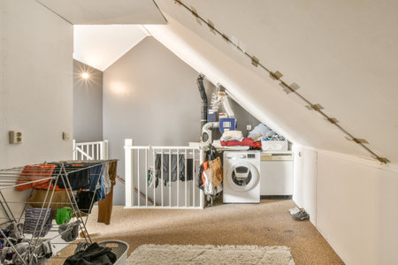 A cozy and spacious mansard styled laundry in a luxury house