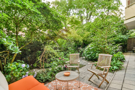 Neat powerful patio with sitting area and small garden