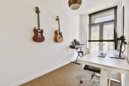 Comfortable chair placed near table with computer monitors against blank whiteboard and mirror in...