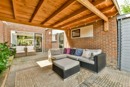 Neat powerful patio with sitting area and small garden