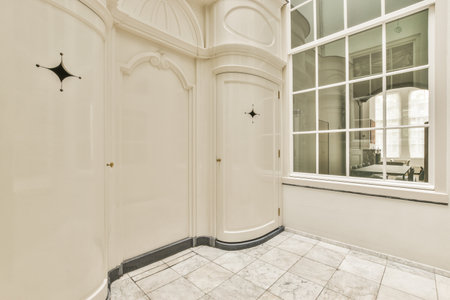 Interior of contemporary flat in minimal style with spacious hallway with white walls