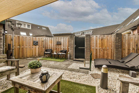 Simple small empty patio with near wooden fence