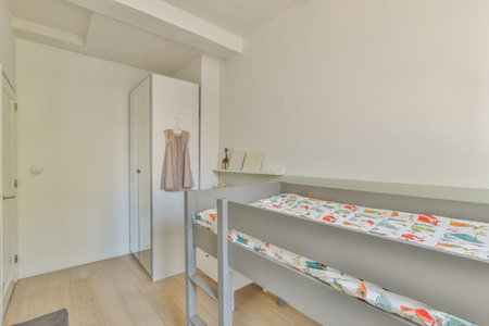 Interior of modern kid bedroom with bed and shelves with various toys at home