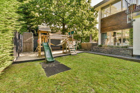 Simple small patio with small garden near wooden fence