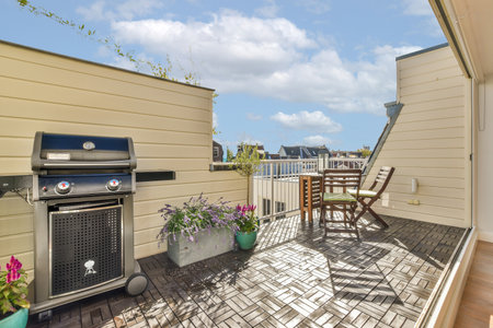 Sitting area in balcony with comfortable furniture around beautiful view