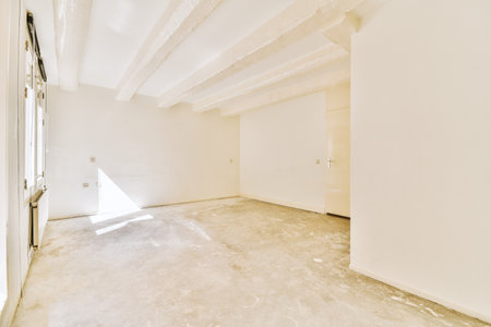 Plastic window and radiator on white wall in empty light room at homeの写真素材