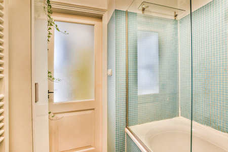 White bathtub with faucet in modern bathroom in minimal style in apartment