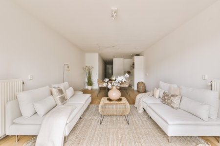 Contemporary minimalist style interior design of light studio apartment with wooden table and chairs...
