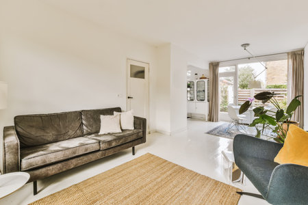 a living room with two couches and a coffee table in the center of the room is an open patio