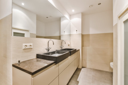 a modern bathroom with marble counter tops and white tiles on the walls, along with two sinks in front of the mirrorの写真素材