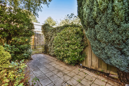 an outdoor patio with trees and bushes in the fore - image by real estate agent, michael stinson
