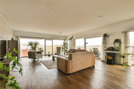 a living room with wood floors and large windows looking out onto the cityscapearl view from insideの写真素材