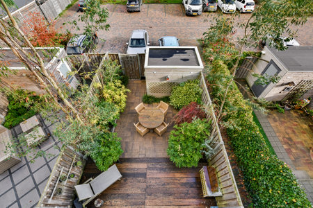 an aerial view of a backyard garden with lots of plants and trees in the center of the photo is a truck parked on theのeditorial素材
