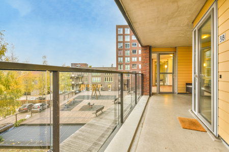 a balcony with a view of the street and buildings in the background, taken from an apartment buildings balconyのeditorial素材