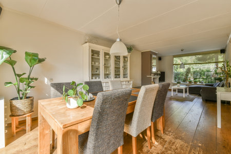 Amsterdam, Netherlands - 10 April, 2021: a dining room with wood flooring and white walls that have been painted in the same color as it appearsのeditorial素材