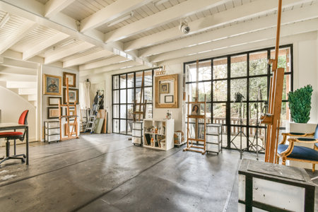 Amsterdam, Netherlands - 10 April, 2021: an artists studio with lots of art work on the walls and floor in front of the windowed roomのeditorial素材