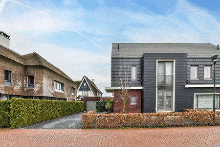 Amsterdam, Netherlands - 10 April, 2021: a house in the middle of an area with brick pavers and...