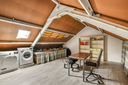 Amsterdam, Netherlands - 10 April, 2021: a laundry room with a washer, dryer and washing machine in the corner on the right hand sideのeditorial素材