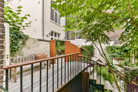 Amsterdam, Netherlands - 10 April, 2021: an outside area with some plants on the balcony and stairs...