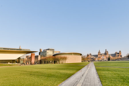 an outside area with grass, buildings and blue sky in the background on a sunny day at university of chicagoのeditorial素材